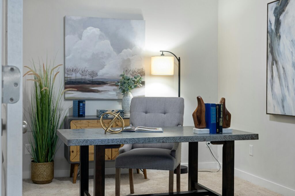 Home office desk with shelving and warm decor
