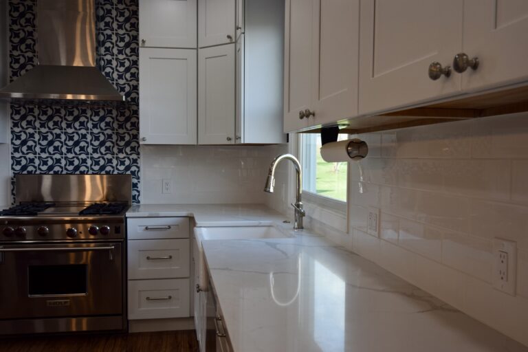 White kitchen with pendant lights over the island