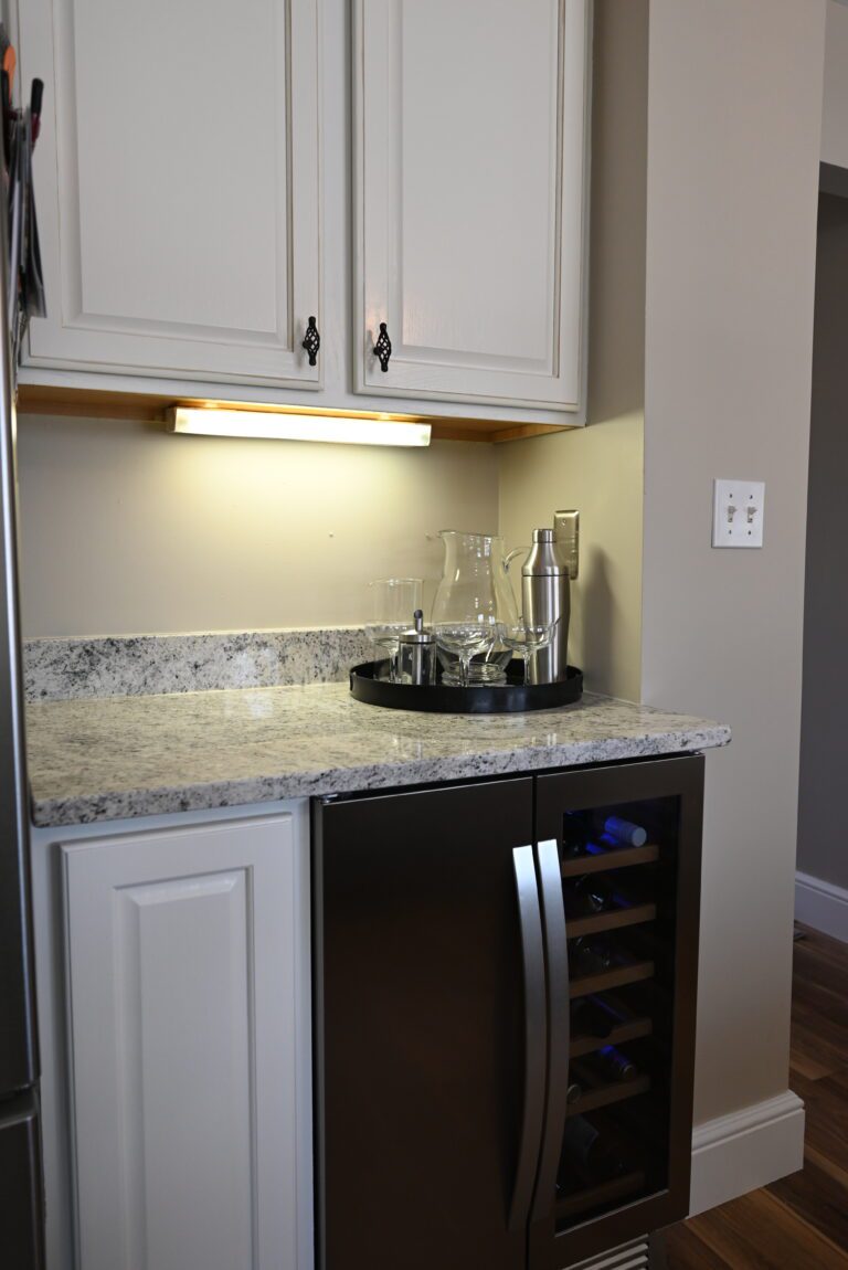 Stone countertop detail beside a stainless range