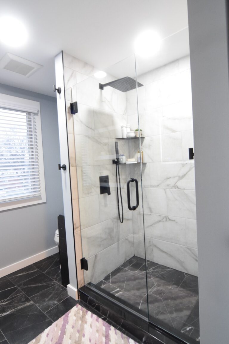 Curbless walk-in shower with marble-look tile