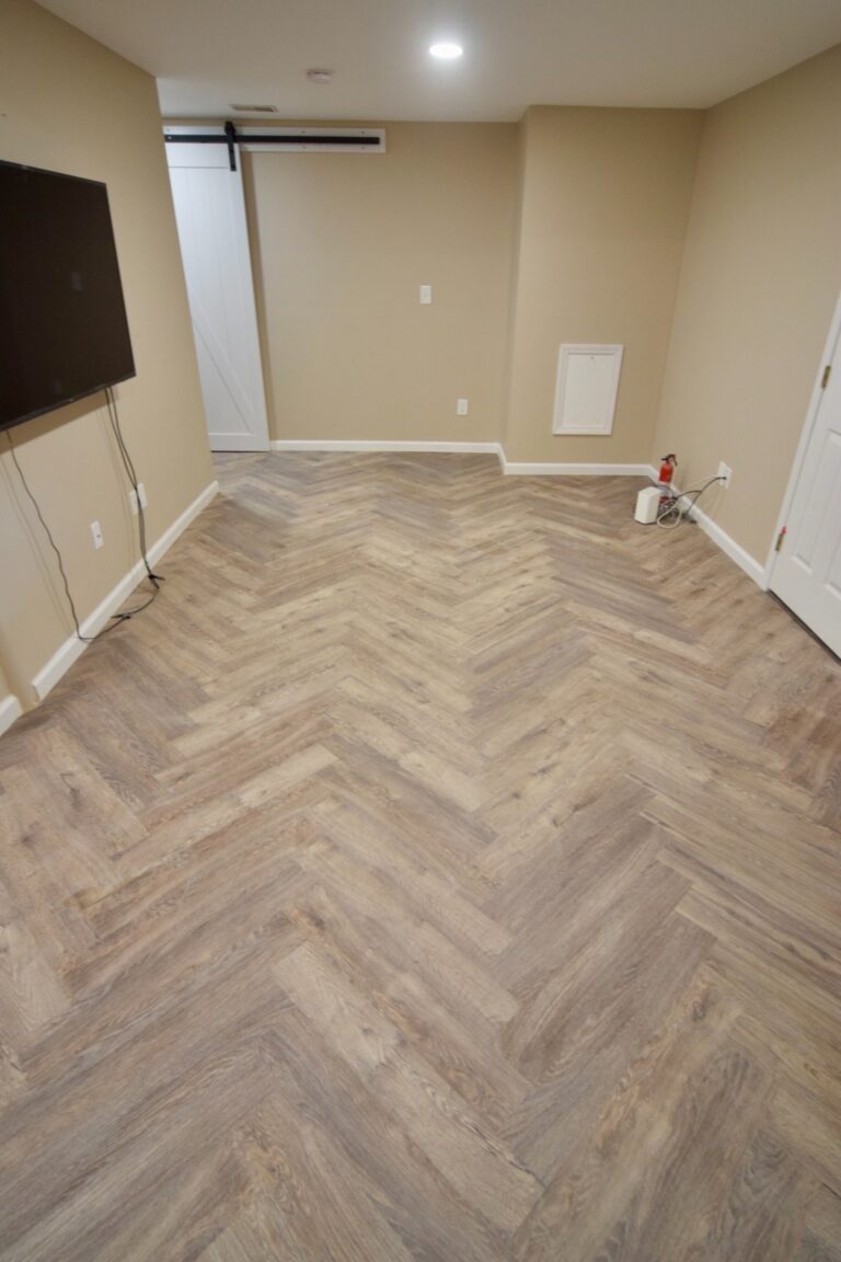 Herringbone floor detail in a finished basement