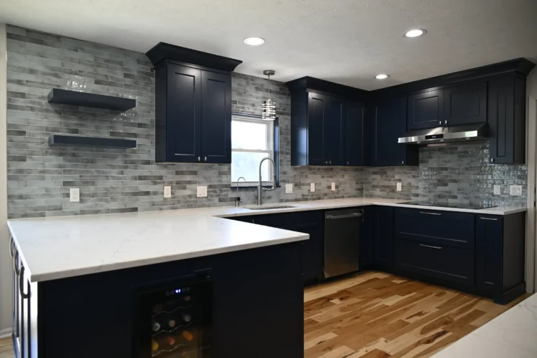 Kitchen and bathroom remodel in Manchester with a bold navy kitchen