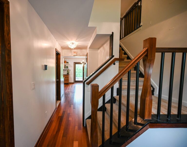 Wood staircase and entry with natural light
