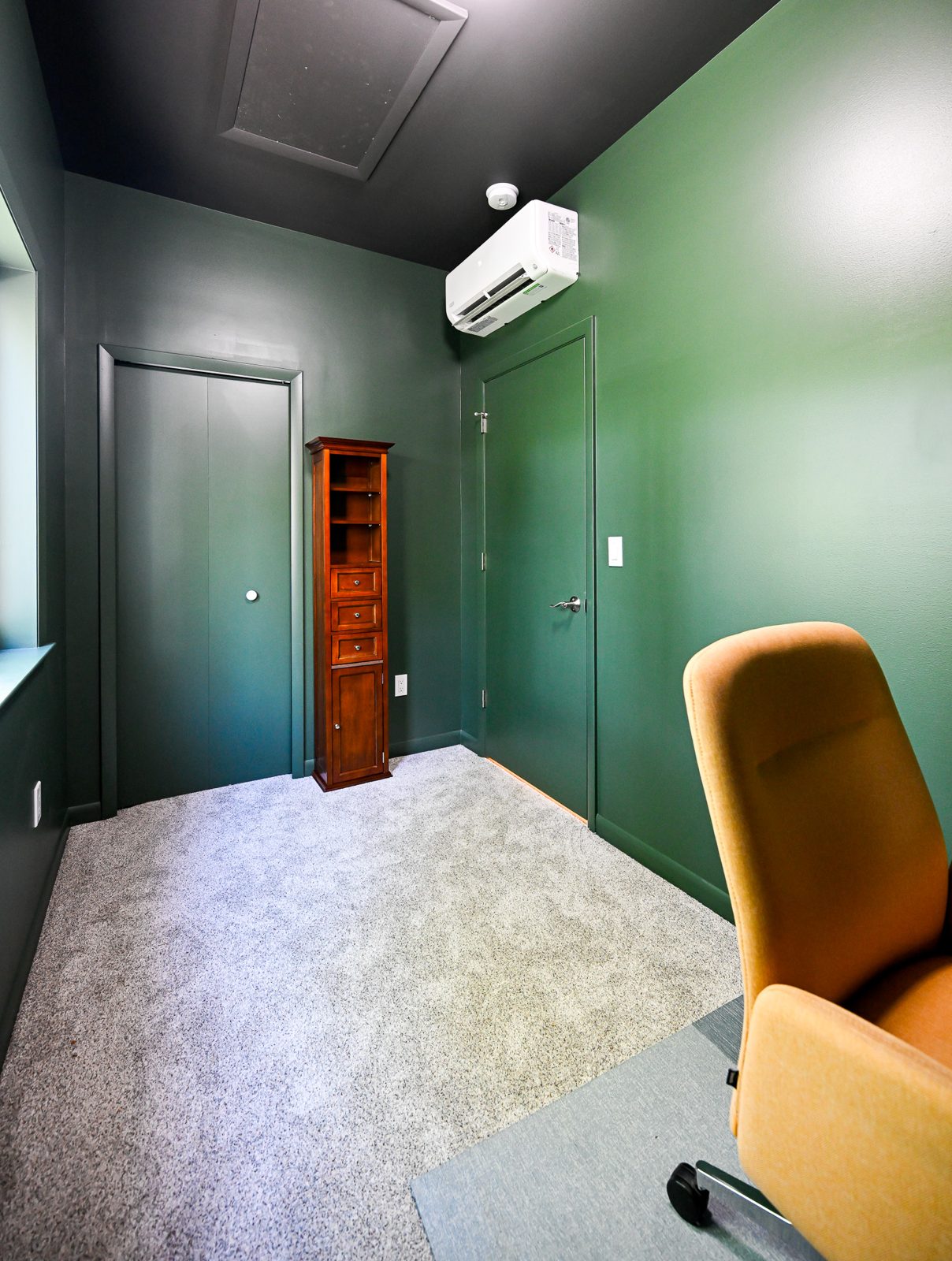 Home office with a ductless mini-split keeping the room comfortable over the garage