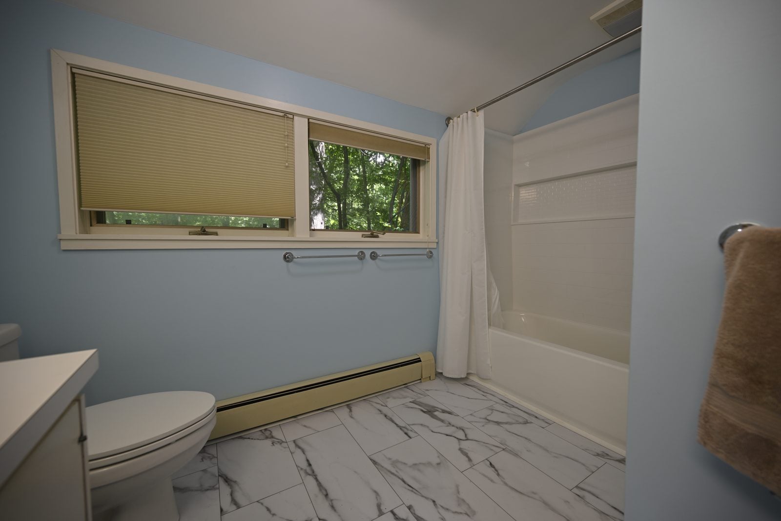 Remodeled Ann Arbor bathrooms with a tiled walk-in shower and a new tub bath