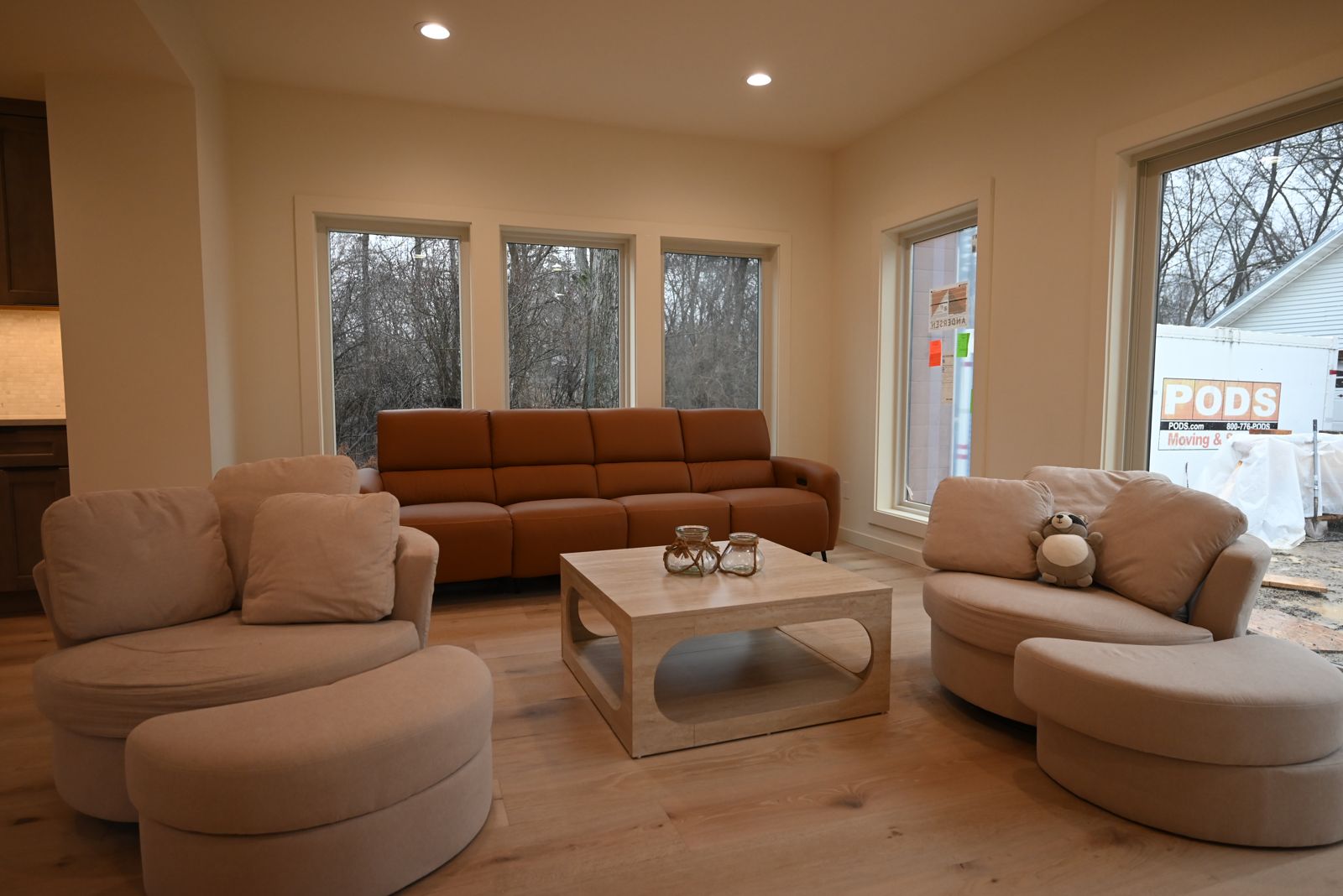 Living room with a leather sofa in the finished Ann Arbor whole home