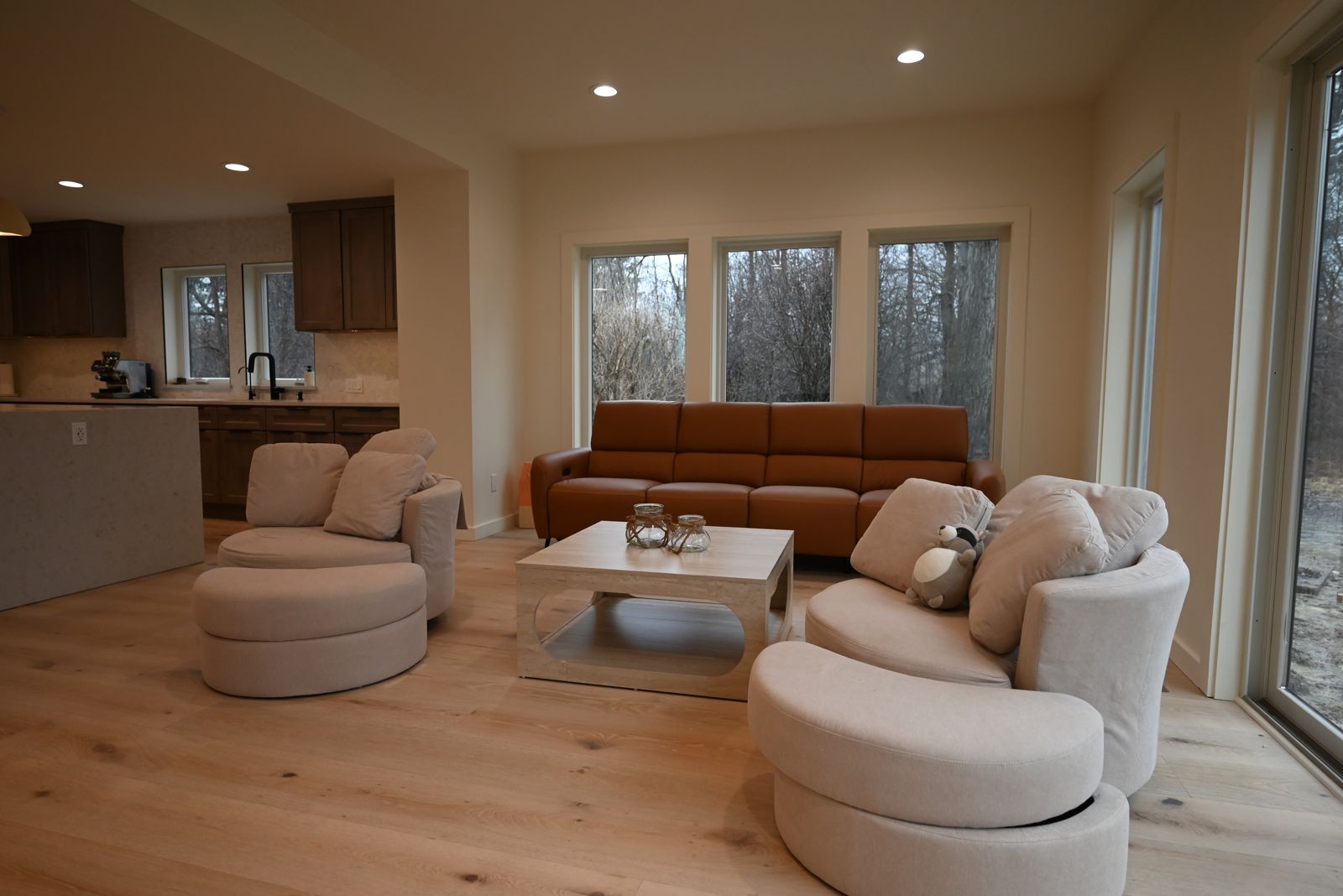 Living room with swivel chairs and large windows in the Ann Arbor whole home project