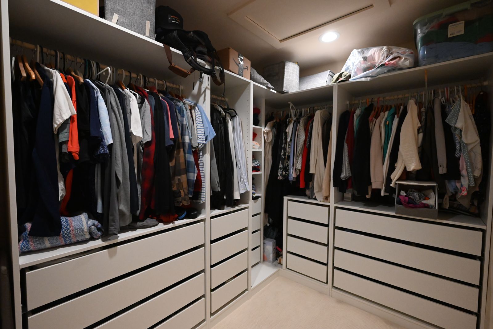 Primary walk-in closet with custom built-ins in the Ann Arbor home