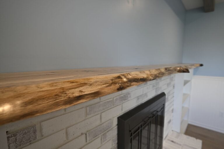 Whole home remodel in Canton with a live-edge fireplace mantel