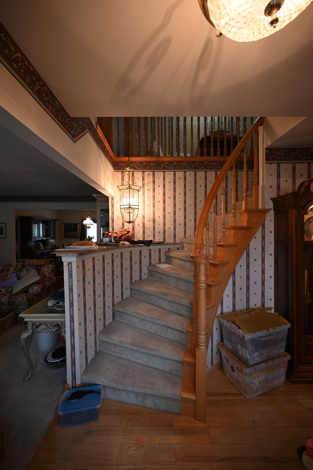 Wallpapered staircase in the Canton home before the remodel