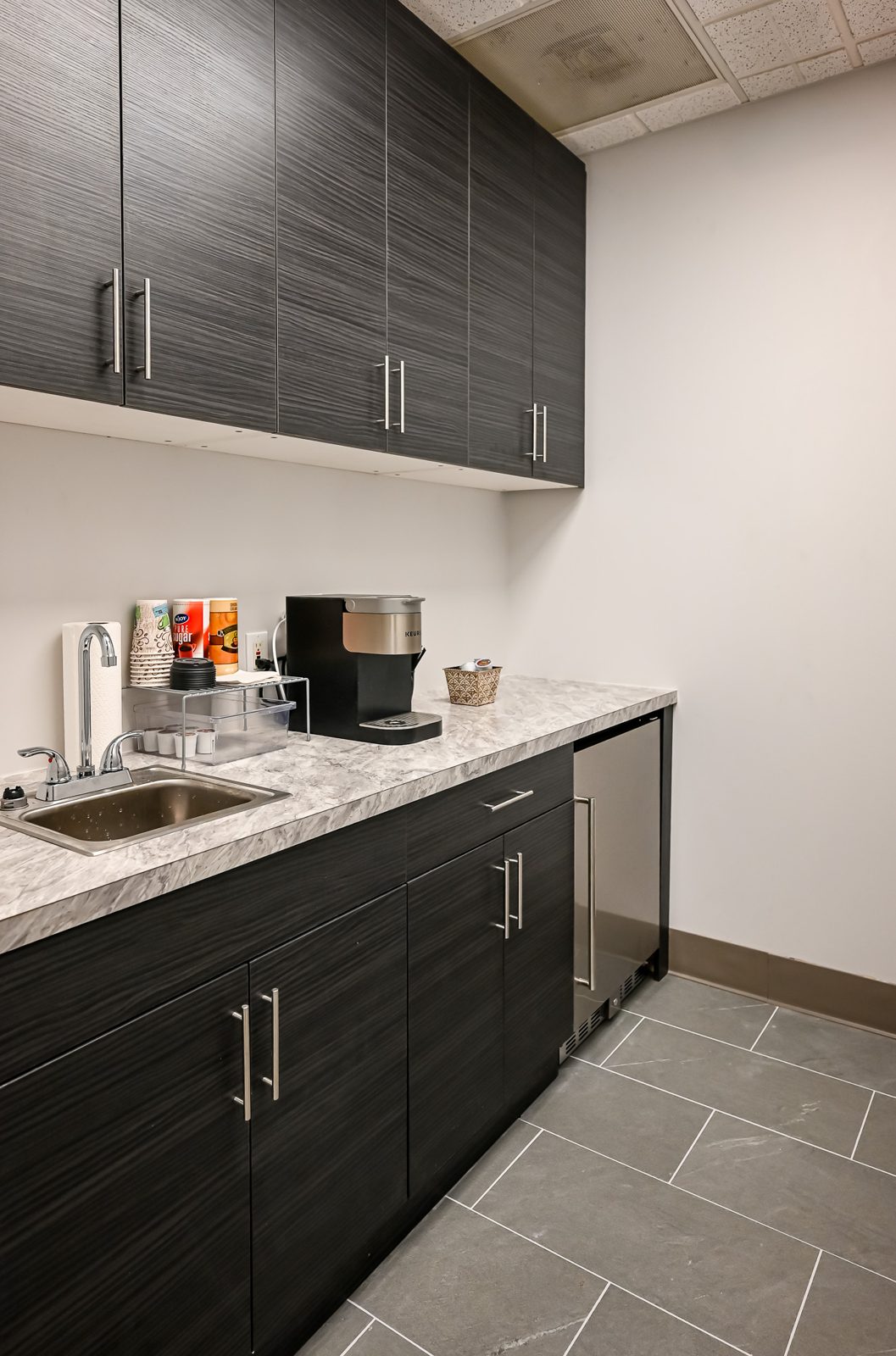 Break room with new cabinetry and counters in the Troy office renovation