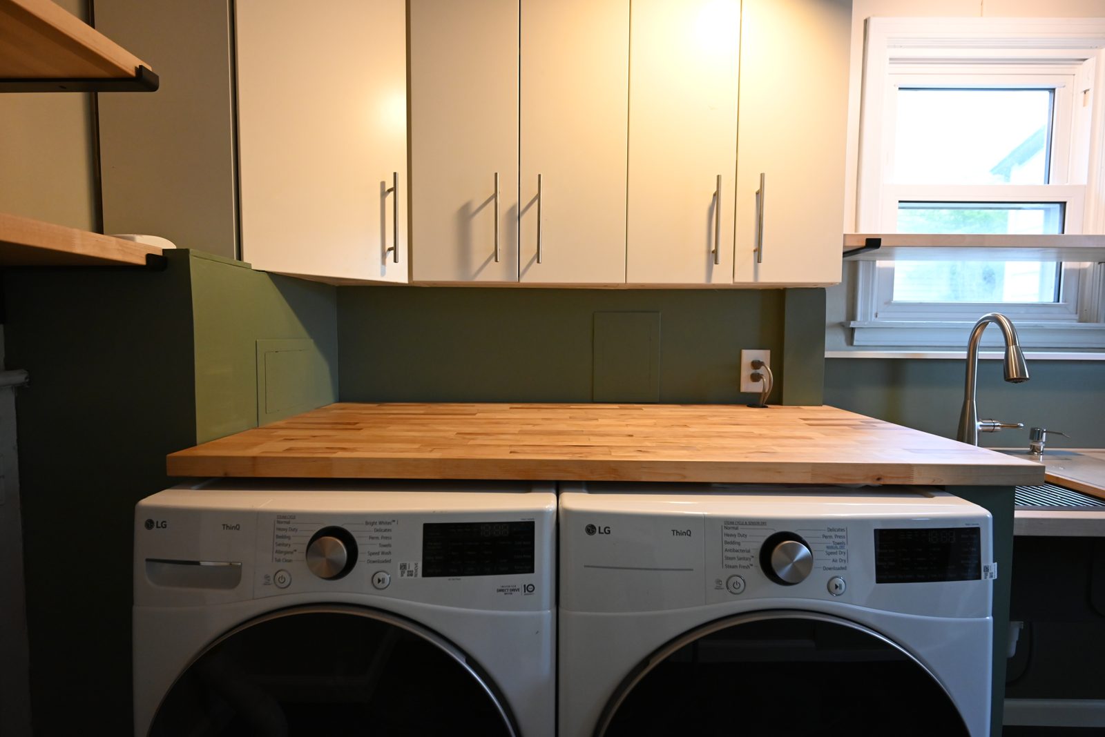 Birch butcher block folding counter installed over a front-load washer and dryer in Ypsilanti