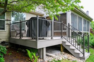 Ypsilanti deck with gray composite boards, black railings and stairs down to the yard