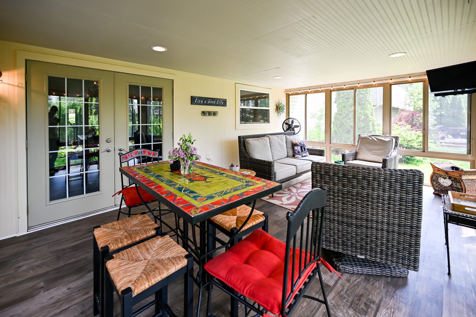 French door and beadboard ceiling inside the remodeled Ypsilanti porch