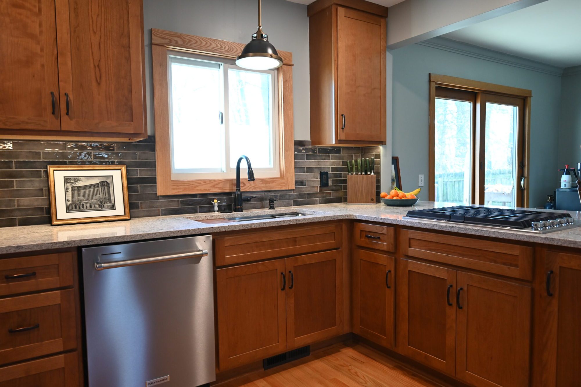 Open kitchen layout with improved flow and natural light in a remodeled Ypsilanti home