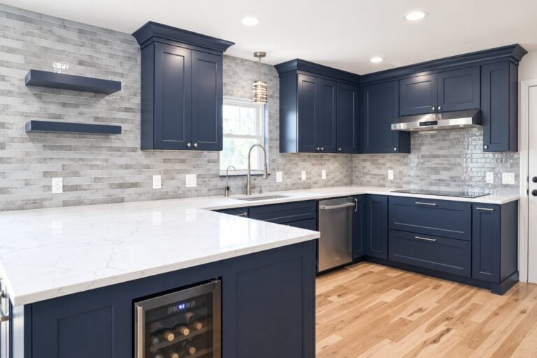Kitchen and bathroom remodel in Manchester with a bold navy kitchen